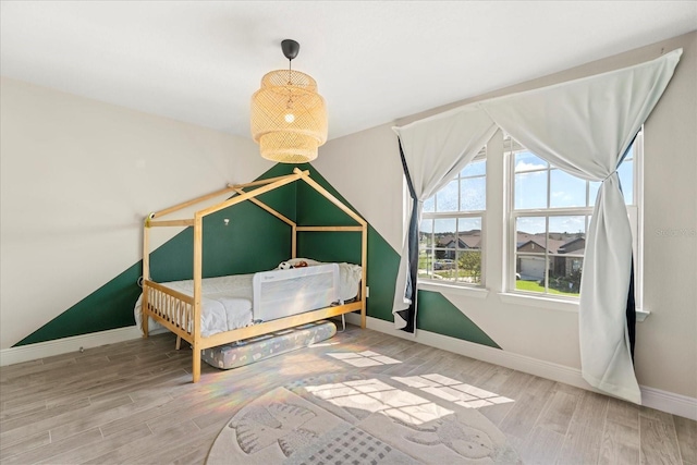 bedroom featuring hardwood / wood-style flooring