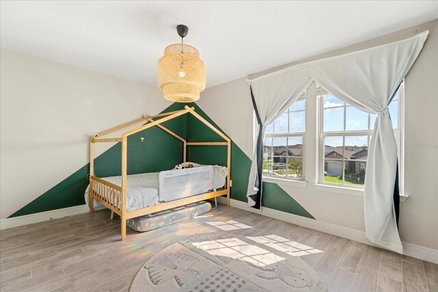 1909 Cayman Cove Cir, Saint Cloud, FL 34772 - bedroom featuring baseboards and wood finished floors
