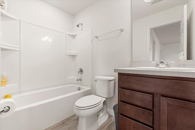 full bathroom featuring vanity, toilet, hardwood / wood-style flooring, and shower / tub combination