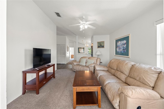 living room with lofted ceiling, carpet, and ceiling fan