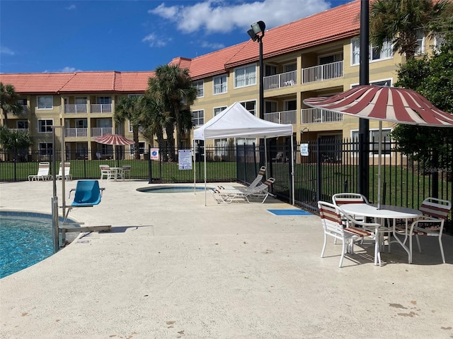 view of swimming pool featuring a patio