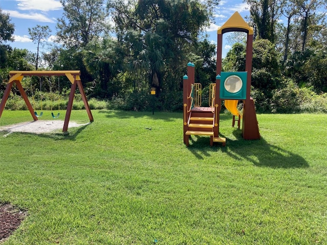 view of playground with a lawn