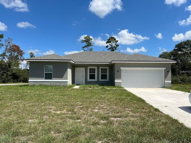 single story home with a front lawn and a garage