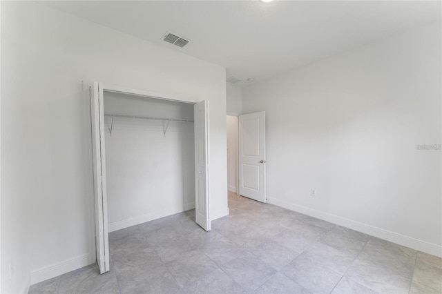 unfurnished bedroom featuring a closet