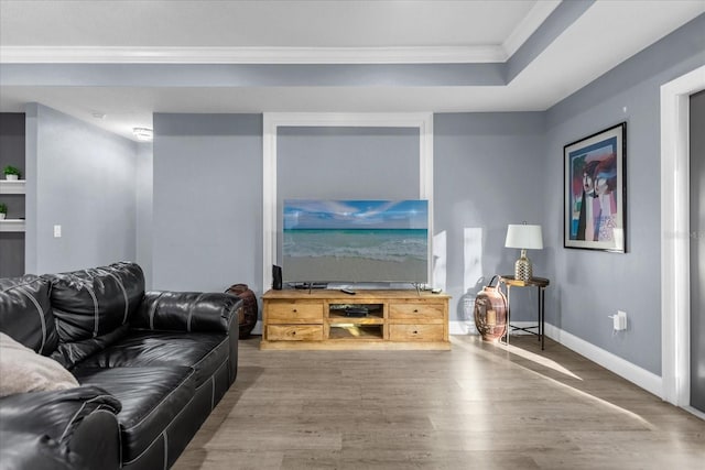 living room featuring crown molding and hardwood / wood-style floors