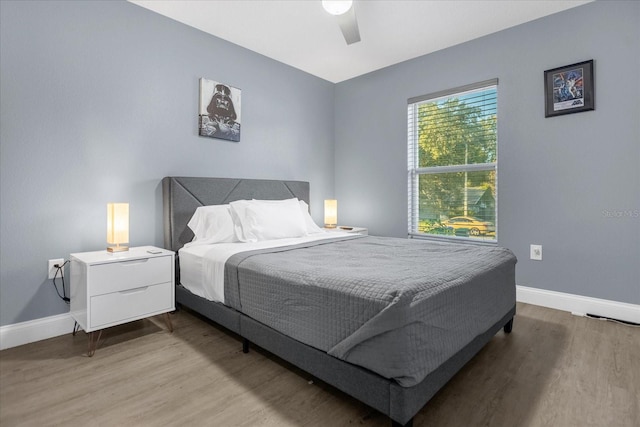 bedroom with hardwood / wood-style flooring and ceiling fan