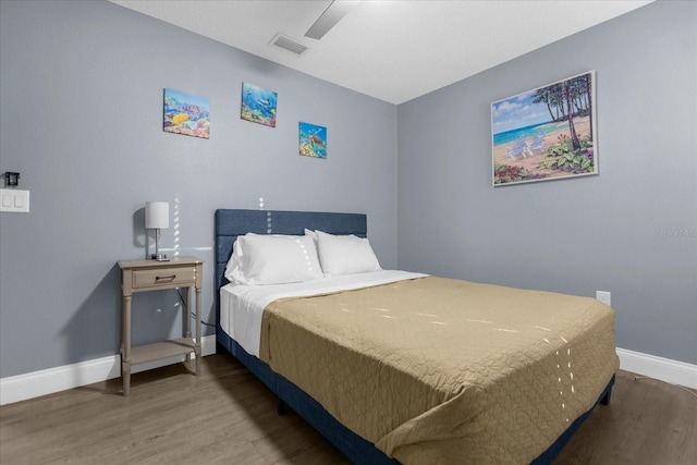 bedroom with hardwood / wood-style floors and ceiling fan