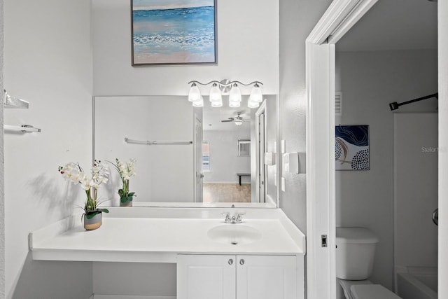 full bathroom with ceiling fan, vanity, toilet, and independent shower and bath