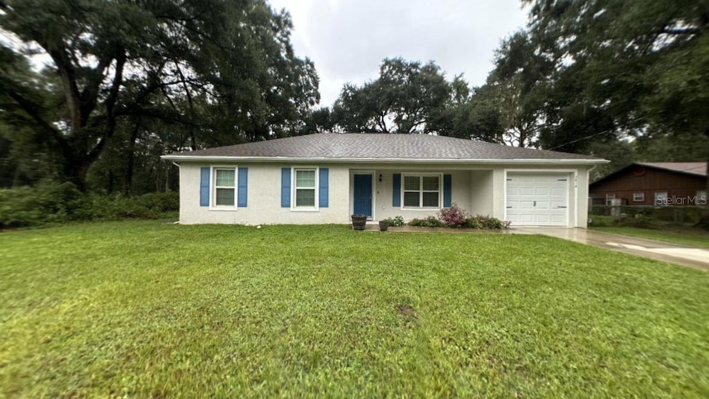 ranch-style house with a front lawn and a garage