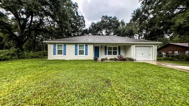 ranch-style house with a garage and a front lawn