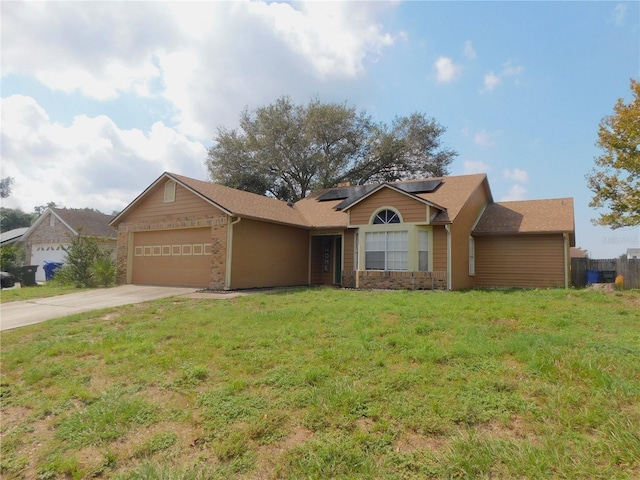 ranch-style house featuring solar panels, a garage, and a front lawn