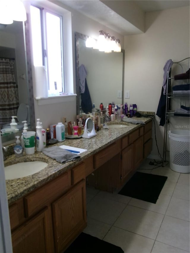 bathroom featuring tile patterned flooring and vanity