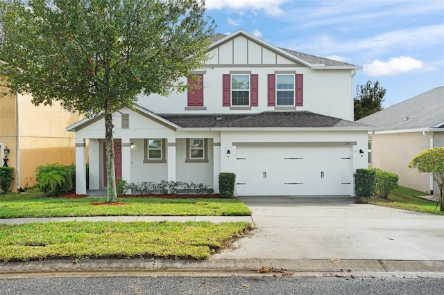 view of front facade featuring a garage and a front lawn