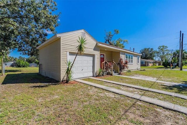 single story home featuring a garage and a front lawn