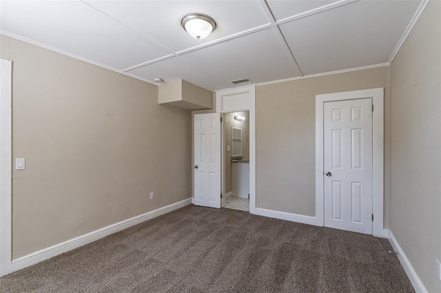 unfurnished bedroom with crown molding and carpet flooring