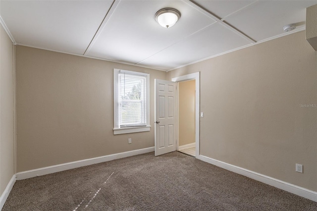 empty room with carpet and ornamental molding