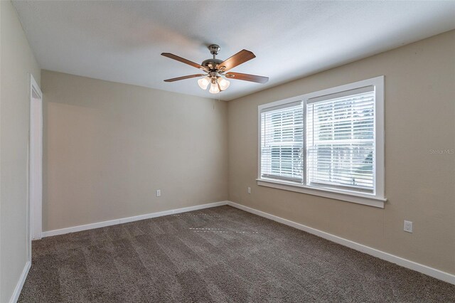 carpeted empty room with ceiling fan