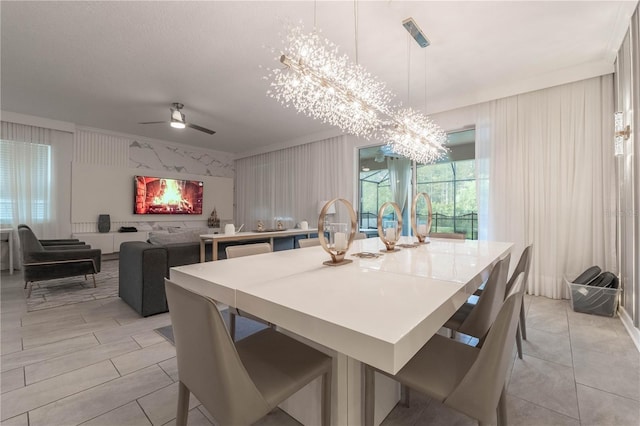 dining room featuring ornamental molding and ceiling fan