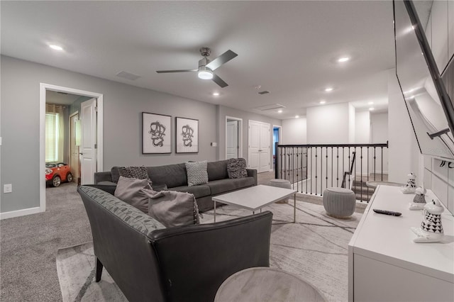 living room with light carpet and ceiling fan