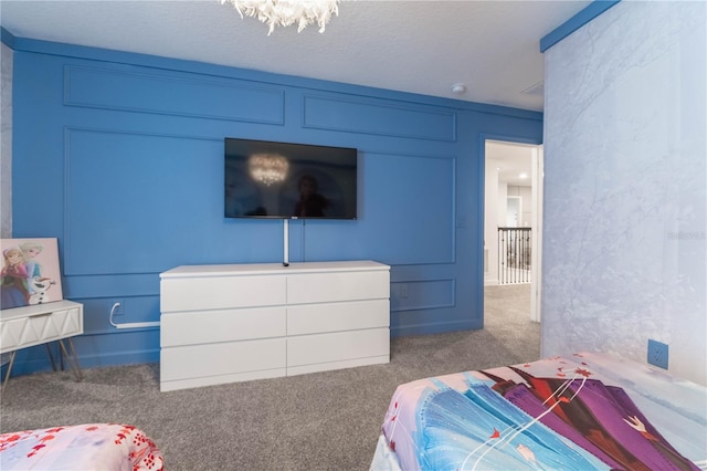 carpeted bedroom with a textured ceiling