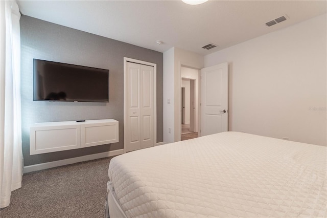 bedroom featuring a closet and carpet floors