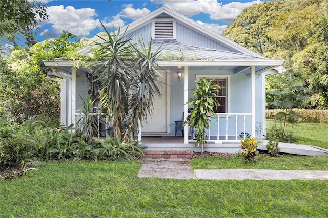 5080 Seminole Ave, Winter Park, FL 32792 - bungalow with a porch and a front yard