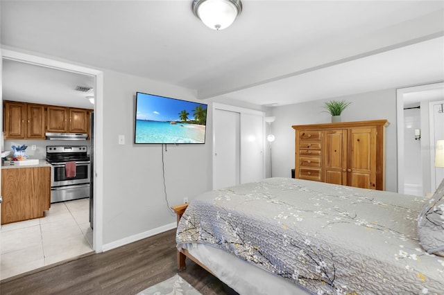 5080 Seminole Ave, Winter Park, FL 32792 - bedroom with a closet, light wood-type flooring, and baseboards