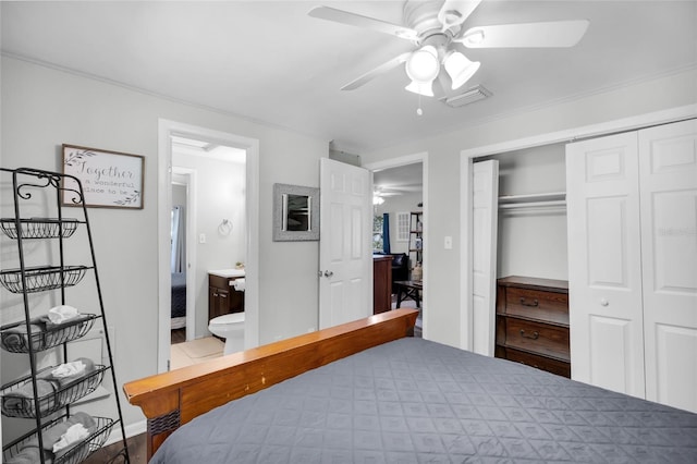 5080 Seminole Ave, Winter Park, FL 32792 - bedroom featuring a closet, connected bathroom, ceiling fan, and crown molding