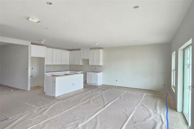 kitchen featuring a center island and white cabinets