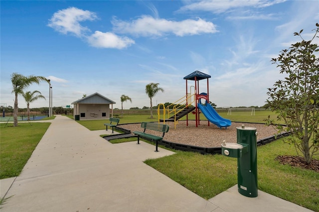 view of jungle gym with a lawn