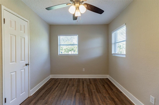 spare room featuring ceiling fan, a textured ceiling, and dark hardwood / wood-style floors