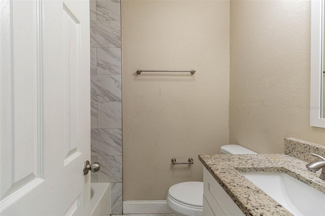 full bathroom with vanity, toilet, and tiled shower / bath