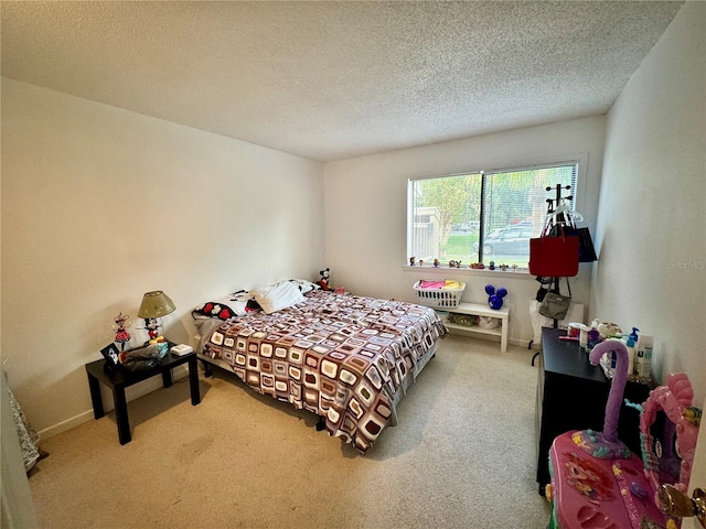 bedroom with carpet flooring and a textured ceiling