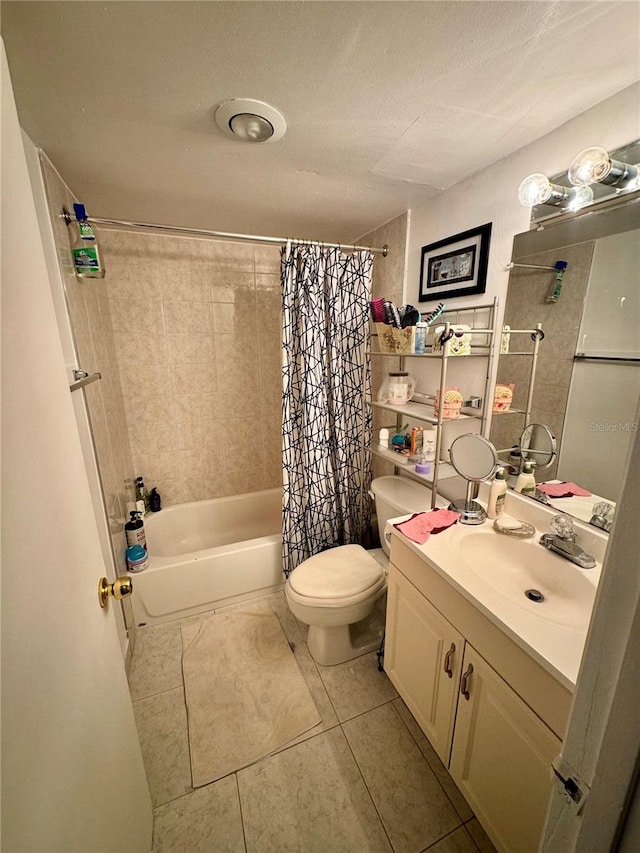 full bathroom with a textured ceiling, toilet, vanity, shower / tub combo with curtain, and tile patterned flooring