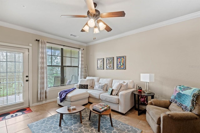 living room featuring ceiling fan, crown molding, and light tile patterned floors