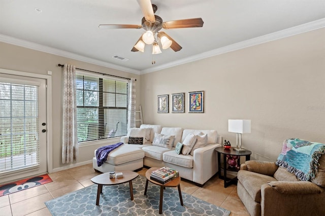 living room featuring visible vents, a ceiling fan, crown molding, and light tile patterned floors
