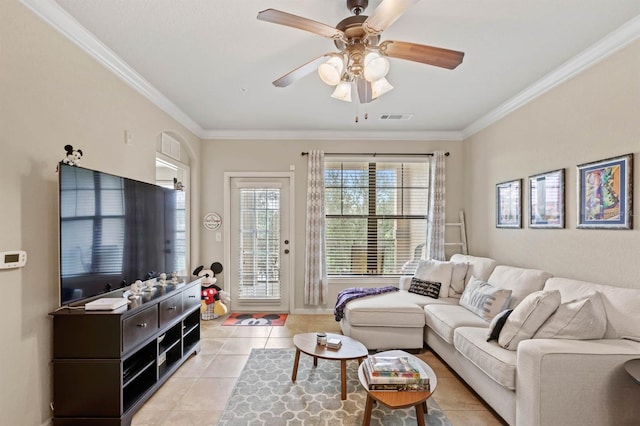 living room featuring crown molding, light tile patterned floors, and ceiling fan