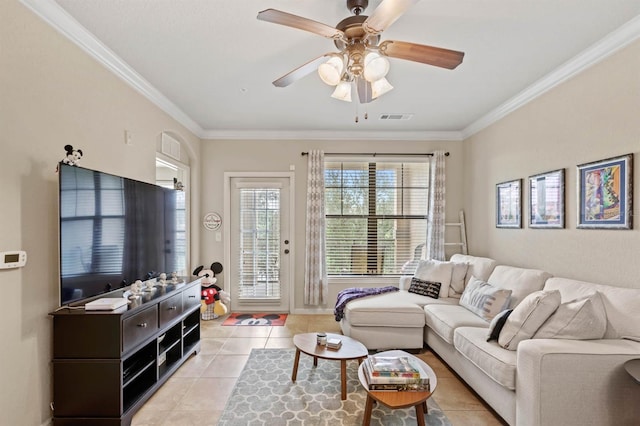 living area featuring visible vents, ornamental molding, a ceiling fan, and light tile patterned flooring
