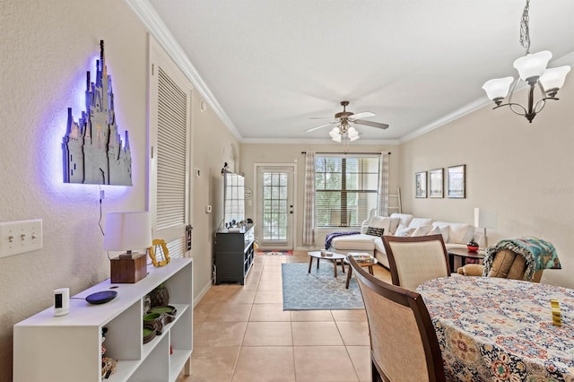 living area featuring light tile patterned floors, baseboards, crown molding, and ceiling fan with notable chandelier