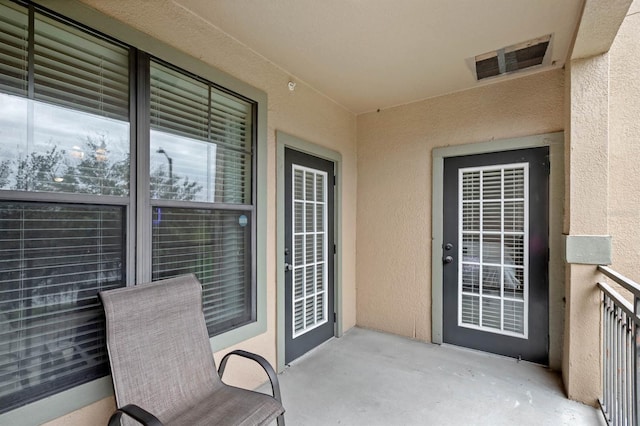 property entrance featuring a patio