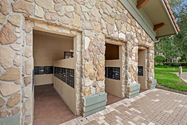 details with stone siding and mail area