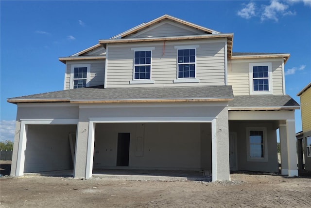 view of front of property featuring a garage