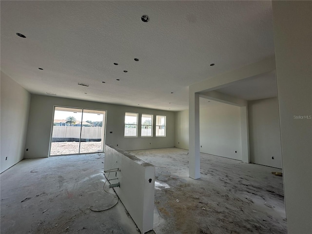 spare room with a textured ceiling