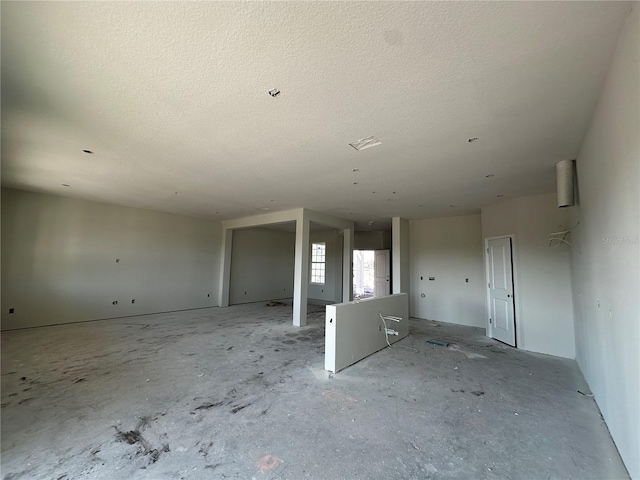 spare room with a textured ceiling