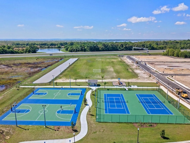 birds eye view of property with a water view