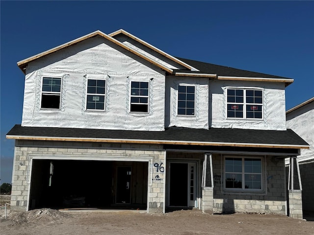 property in mid-construction featuring a garage