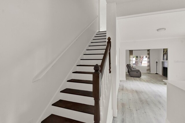 stairway with hardwood / wood-style flooring