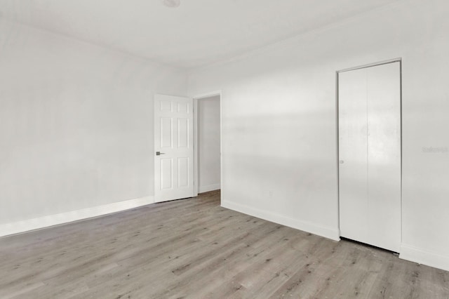 unfurnished bedroom with light wood-type flooring