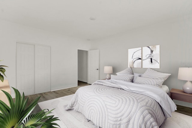 bedroom featuring light hardwood / wood-style flooring and a closet