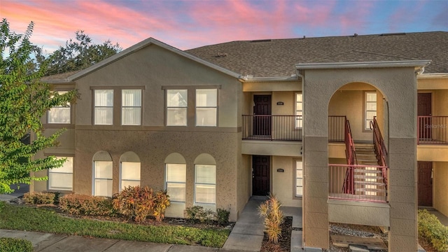 view of front of home with a balcony